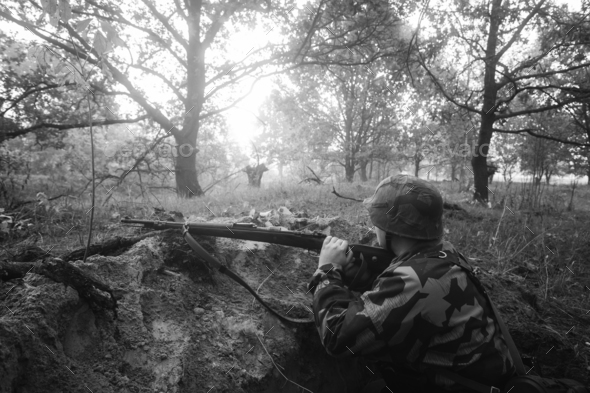German Wehrmacht Infantry Soldier In World War II Hidden Sitting - Stock Photo - Images