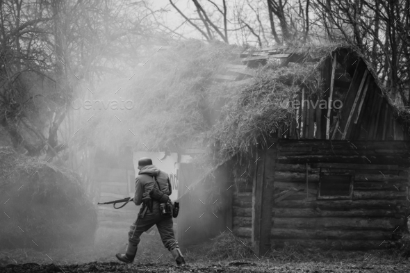 German Wehrmacht Infantry Soldier In WW II Running On Battlefiel - Stock Photo - Images