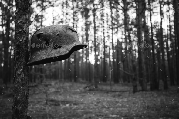 Damaged By Bullets And Shrapnel Metal Helmet Of German Infantry - Stock Photo - Images