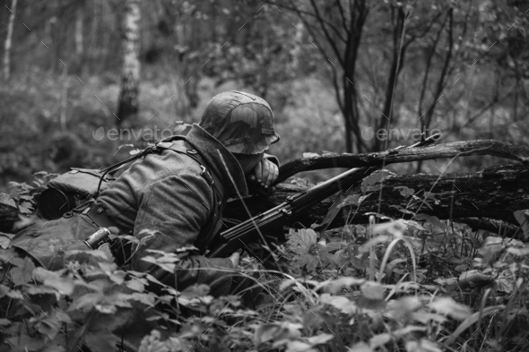 German Wehrmacht Infantry Soldier In World War II Hidden Sitting - Stock Photo - Images
