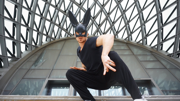 Man Dance in Mask in City