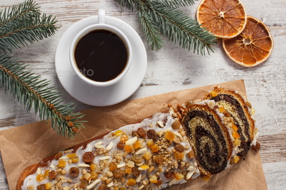 Poppy seeds cake, cup of coffee and spruce branches, christmas time