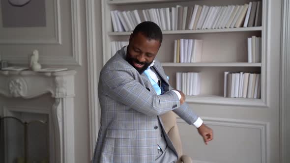 Cheerful African-American with a Beard, in a Stylish Gray Suit. The Businessman alt