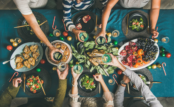 Company of friends or family celebrating Christmas together - Stock Photo - Images