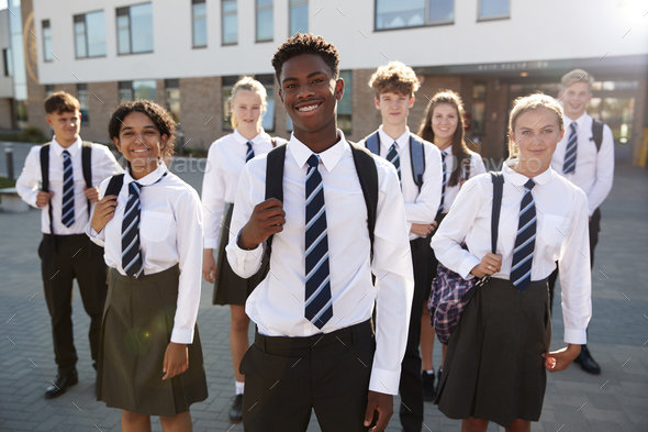 Portrait Of Smiling Male And Female High School Students Wearing ...