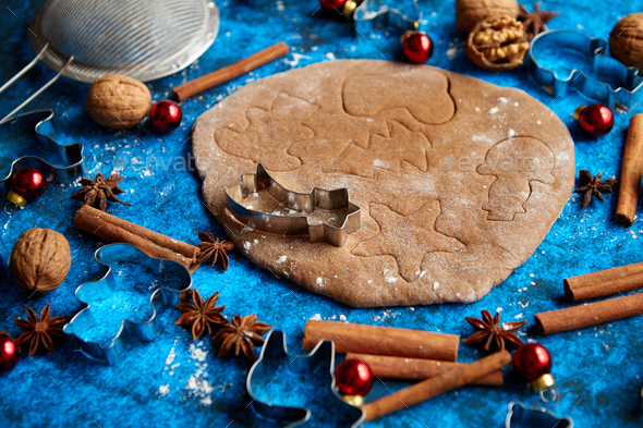 Christmas baking concept. Gingerbread dough with different cutter shapes