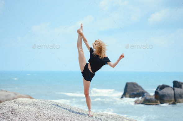 Sport girl on a beach Stock Photo by prostooleh