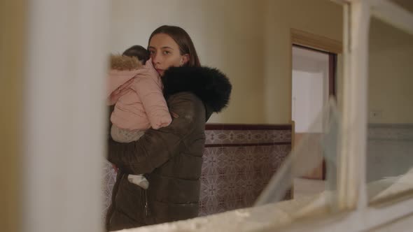 Distressed single mom worrying about safety of her child during Ukraine war alt