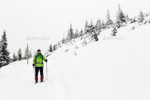 Winter hike in white, man and adventure concept - Stock Photo - Images