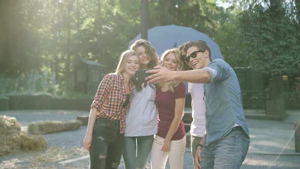 Happy Friends Taking Photos And Having Fun On Weekend alt