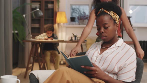 10-Year-Old Afro Girl Hugging Mother alt