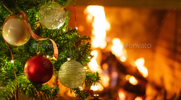 Download Christmas Tree Close Up On Blurred Burning Fireplace Background Stock Photo By Rawf8 PSD Mockup Templates