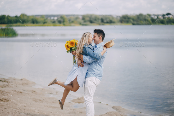 couple near water - Stock Photo - Images