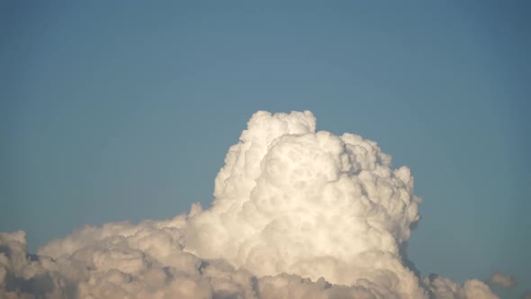 8K White Cloud Exploding In Blue Sky