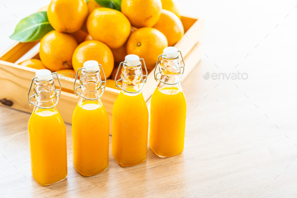 Fresh orange juice for drink in bottle glass Stock Photo by siraphol