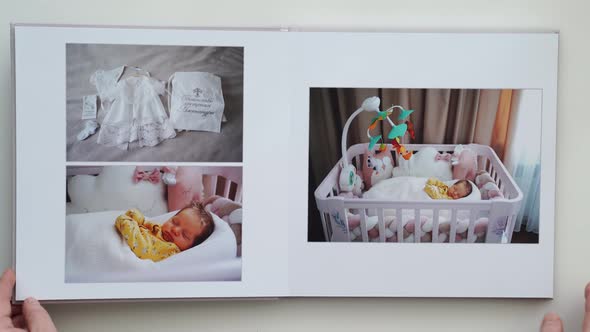 on White Table Photobook From Photo Shoot of Family with Newborn alt