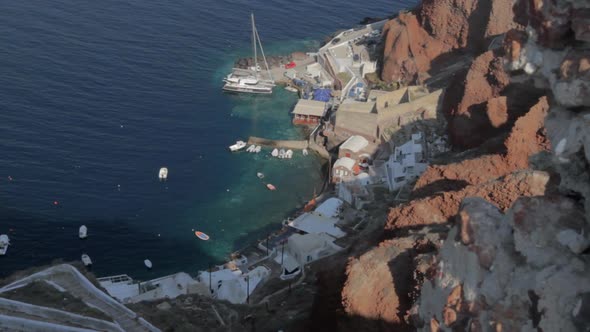 Small fishing and tourist harbor seen from high above. Kamari Santorini. alt