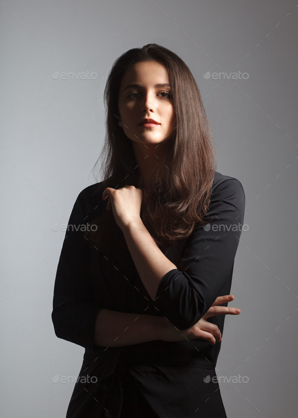 beautiful female studio portrait with deep shadows Stock Photo by schum45
