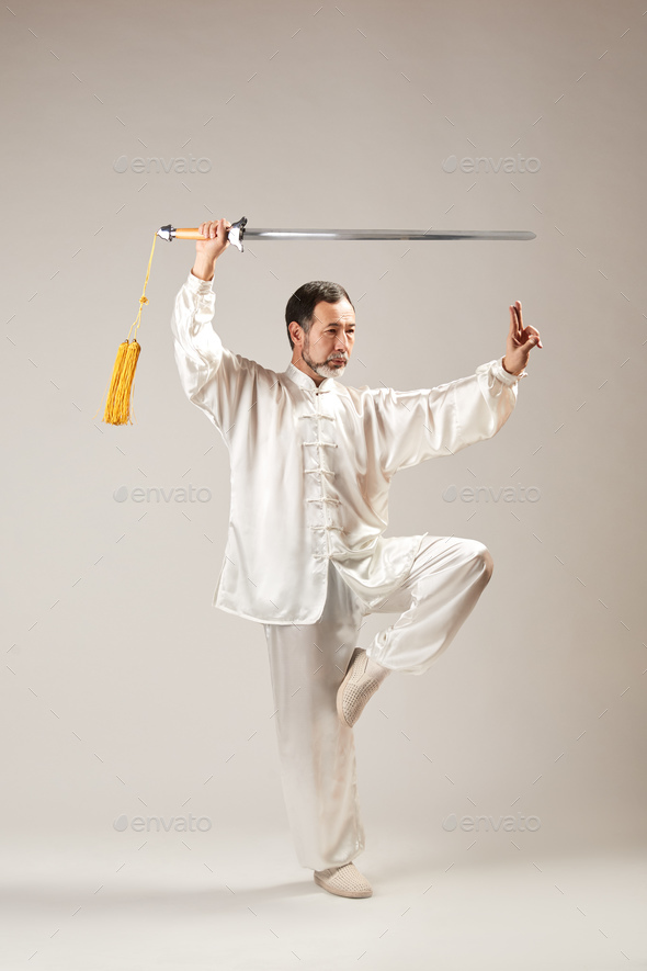 Senior master practicing qi qong taijiquan - Stock Photo - Images