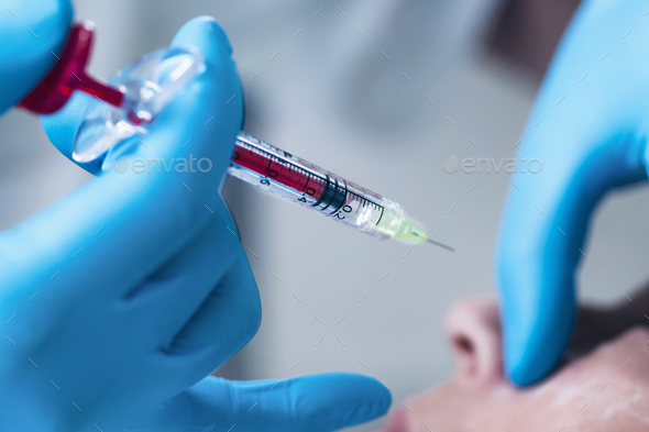 Hyaluronic Acid Injection. Cosmetic Anti-Aging Face Treatment - Stock Photo - Images