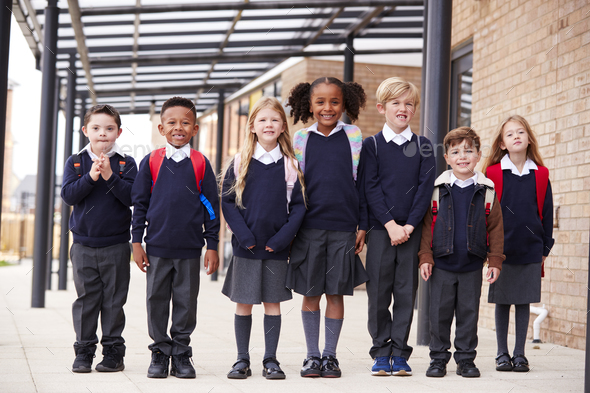 The Primary School Students Standing in Yard. Stock Image - Image