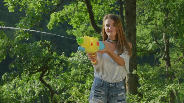 Girl with a water pistol alt
