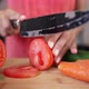 Unrecognizable Housewife Slicing Tomato in Slow Motion on Cutting Board - VideoHive Item for Sale