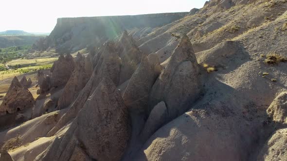 Hoodoos, Fairy Chimneys and Sedimentary Volcanic Rock Formations in Eroded Stone Valley alt