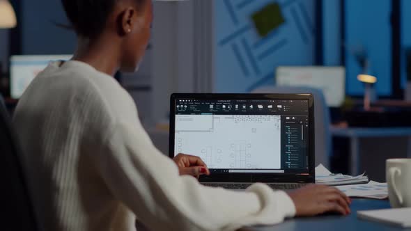 African Engineer Constructor Designer Architect Analysing New Bluilding Plan alt