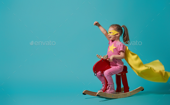 child playing superhero - Stock Photo - Images