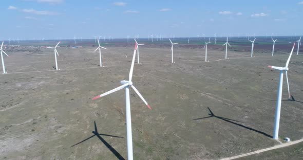Aerial view of windmills farm. Modern wind turbines. alt