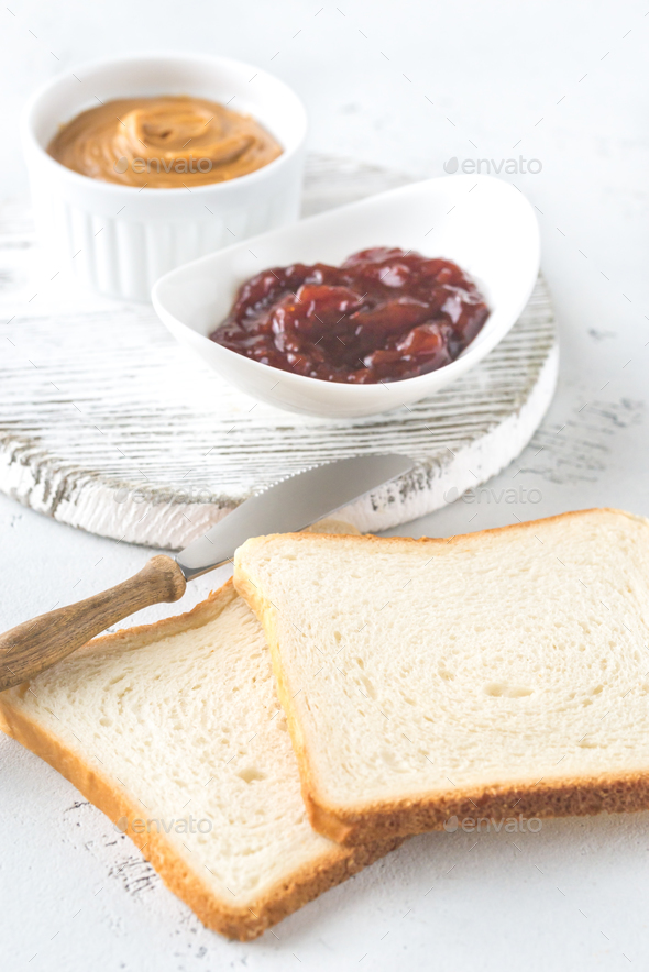 Toast with peanut butter and strawberry jam Stock Photo by Alex9500