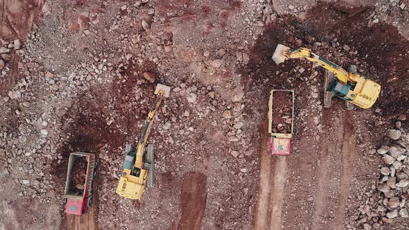 Excavator Fills Dump Truck alt