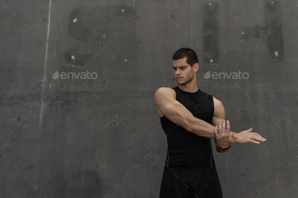 Strong muscular, sporty man warming up, getting ready for training - Stock Photo - Images