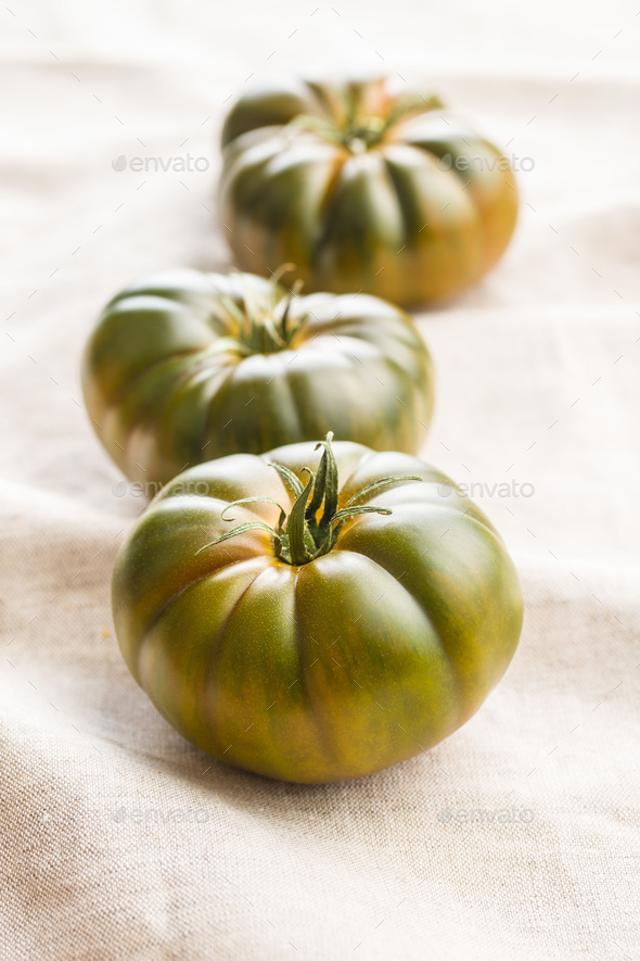 Dark brandywine tomatoes. Stock Photo by jirkaejc PhotoDune
