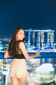 Beautiful Asian women smile and happy with singapore city view - PhotoDune Item for Sale