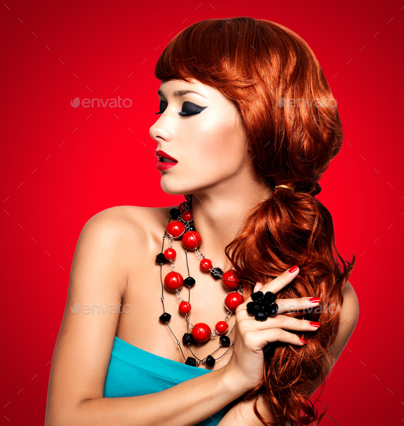 Beautiful fashionable woman with red nails and red hairs - Stock Photo - Images