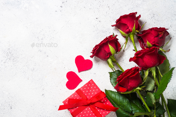 Valentines day background. Red roses, hearts and present on white. Stock  Photo by Nadianb