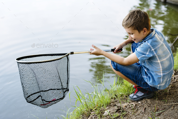 Boy fishing with a net Stock Photo by Rawpixel