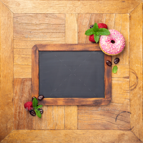 Black chalkboard with pink glazed donut - Stock Photo - Images