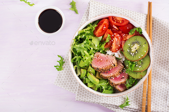 Traditional salad with pieces of medium-rare grilled Ahi tuna and sesame