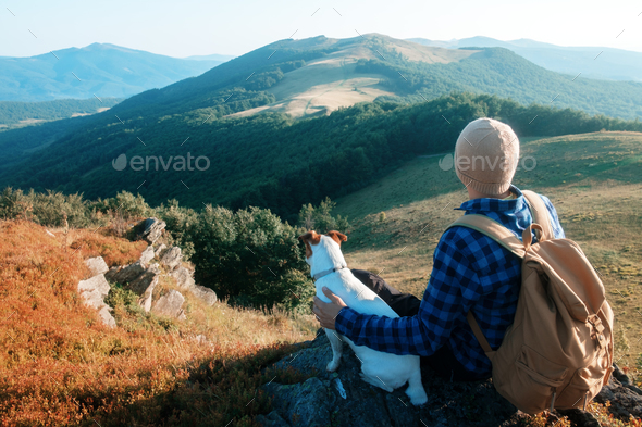 Alone tourist sitting on the edge of the cliff - Stock Photo - Images
