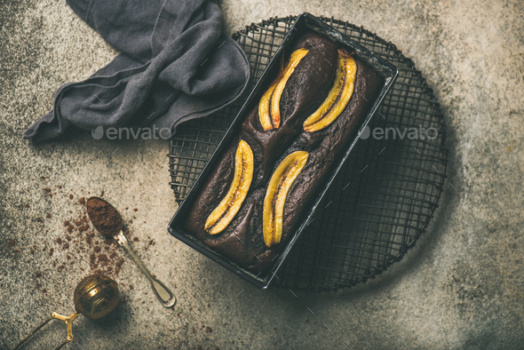 Chocolate banana bread cake with cinnamon in baking tin - Stock Photo - Images