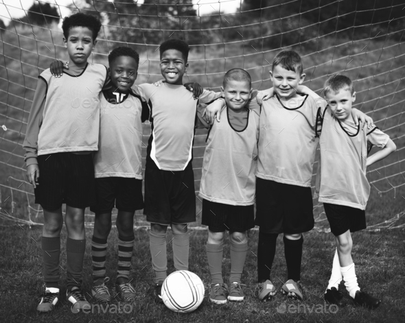 Junior football team standing together