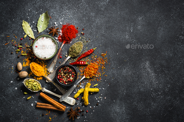 Set of various spices on black stone background. - Stock Photo - Images