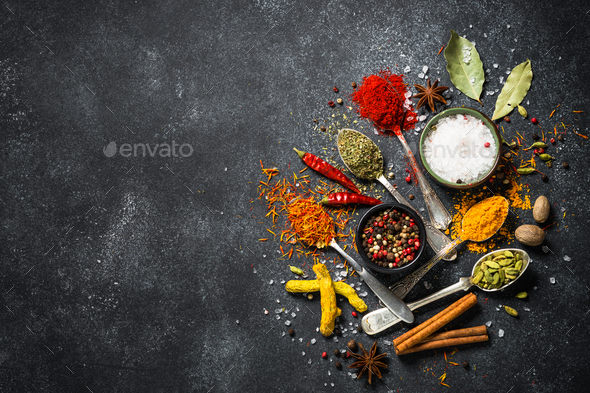 Set of various spices on black stone background. - Stock Photo - Images