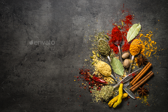 Set of various spices on black stone background. - Stock Photo - Images