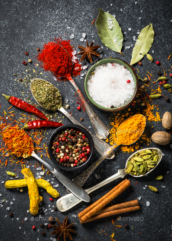 Set of various spices on black stone background. - Stock Photo - Images