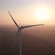 Windmills with rotating wings at sunrise or sunset or sunrise. - VideoHive Item for Sale