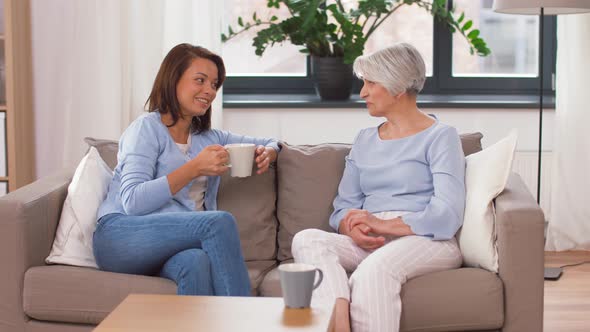 Senior Mother and Daughter with Coffee Talking 12 alt